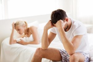 people, relationship difficulties, conflict and family concept - unhappy couple having problems at bedroom